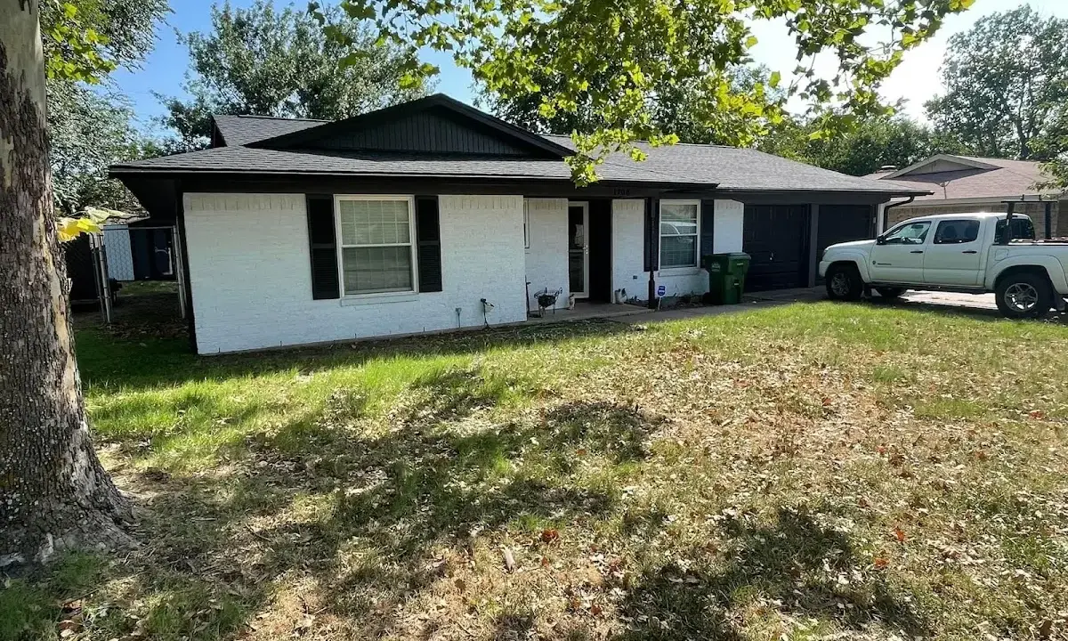 Professional roofing crew working on a residential roof in Lochbuie